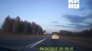 Russian_Military_helicopter_MI-8_passes_a_car_on_the_freeway_very_low