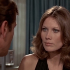 James Bond Roger Moore Andrea Anders.jpg