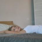 sexy-girl-white-tank-top-blue-short-denim-shorts-lying-bed-sexy-girl-white-tank-top-blue-short-deni