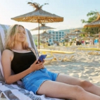 165068368-vacation-at-sea-weekend-on-beach-beautiful-tanned-teenager-girl-in-t-shirt-shorts-with-we