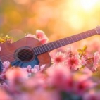 tapeta-gitara-lezaca-wsrod-rozowych-kwiatow