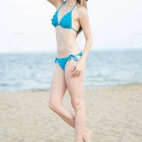 34071321-young-lady-sunbathing-on-a-beach-beautiful-woman-posing-at-the-summer-sand-beach-outdoor-s