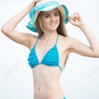 34071324-young-lady-sunbathing-on-a-beach-beautiful-woman-posing-at-the-summer-sand-beach-outdoor-s