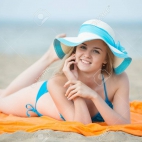 34071331-young-lady-sunbathing-on-a-beach-beautiful-woman-posing-at-the-summer-sand-beach-outdoor-s