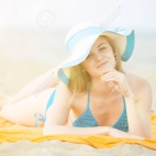 34071334-young-lady-sunbathing-on-a-beach-beautiful-woman-posing-at-the-summer-sand-beach-outdoor-s