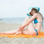 43073453-young-lady-sunbathing-on-a-beach-beautiful-woman-posing-at-the-summer-sand-beach-