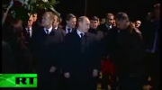 Putin, Tusk lay flowers at plane crash site near Smolensk